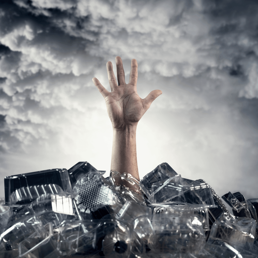 Hand reaching out from a pile of plastic waste symbolizing the impact of plastic pollution. ๐ Understanding Plastic Pollution: The Facts You Need to Know.