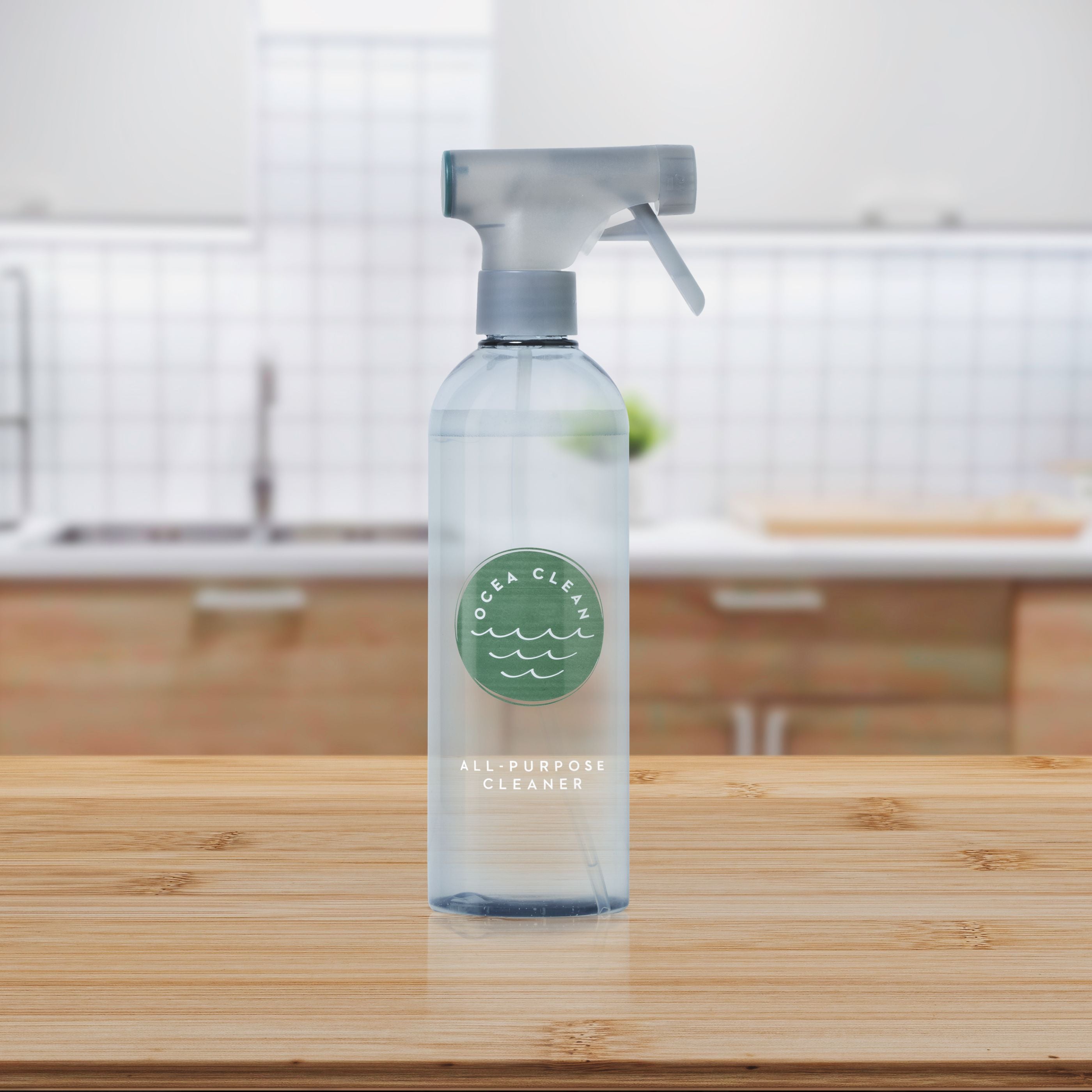 Ocea Clean All-Purpose Cleaner bottle in a modern kitchen setting on wooden countertop.