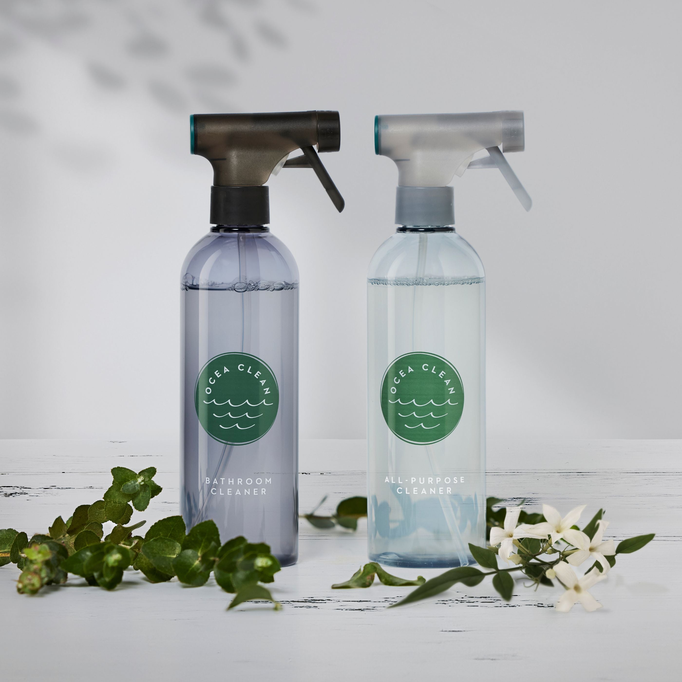 Ocea Clean Complete Cleaning Kit featuring bathroom and all-purpose cleaner bottles on a wooden surface.
